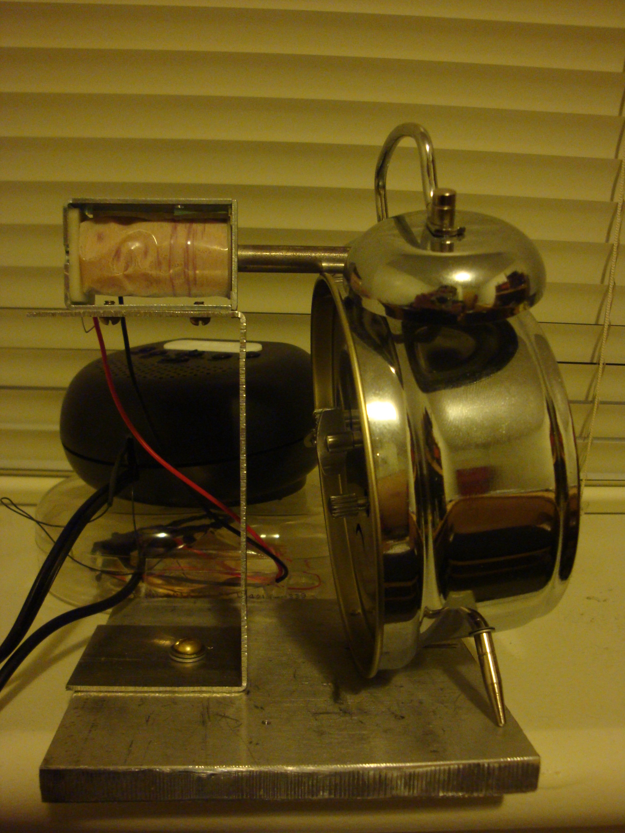 Side view of the setup with the mechanical alarm clock.